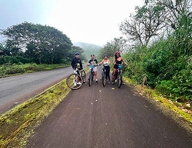 Cyclists on Santa Cruz Island, Galapagos.